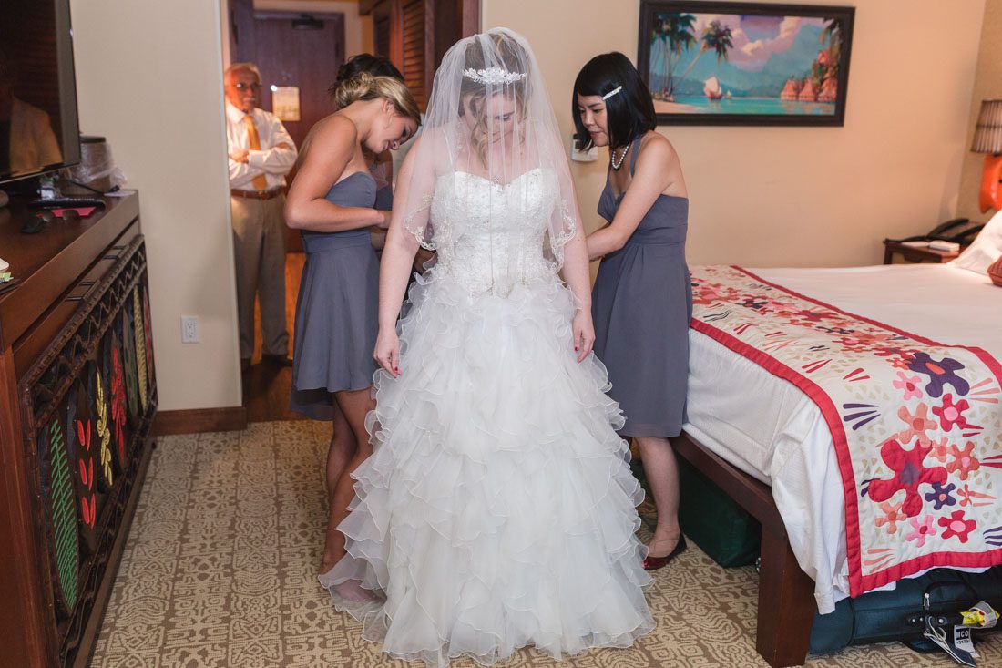 Disney wedding photography at the pavilion and grand floridian resort with Beauty and the Beast theme by top Orlando wedding photographer and videographer