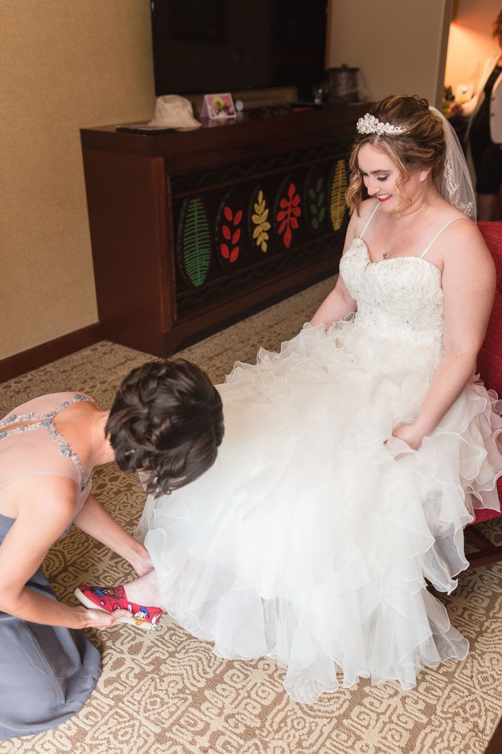 Disney wedding photography at the pavilion and grand floridian resort with Beauty and the Beast theme by top Orlando wedding photographer and videographer