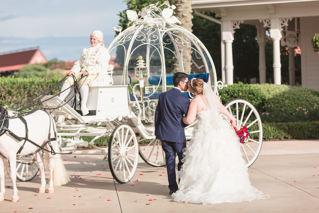 Romantic Disney wedding in Orlando featuring Cinderella's coach and a beauty and the best theme captured by top Orlando wedding photographer and videographer