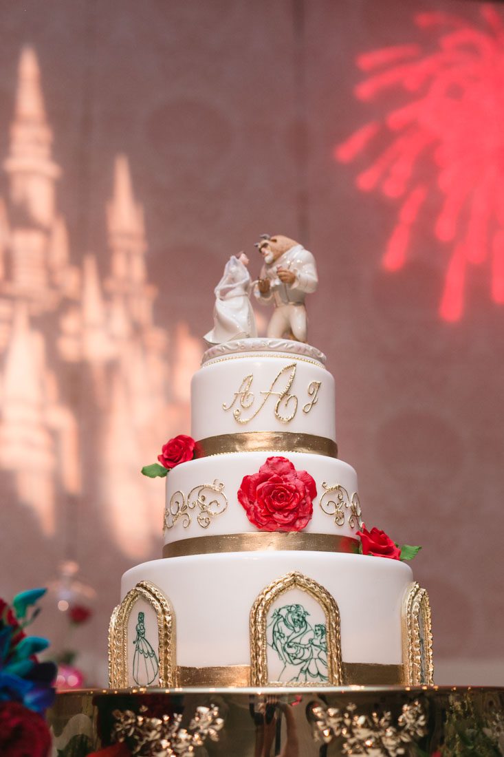 Romantic Disney wedding photography in Orlando featuring a red beauty and the best theme captured by top Orlando wedding photographer and videographer