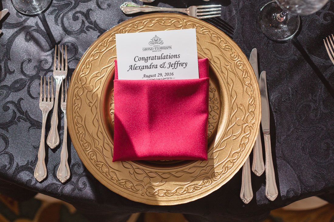 Romantic Disney wedding photography in Orlando featuring a red beauty and the best theme captured by top Orlando wedding photographer and videographer