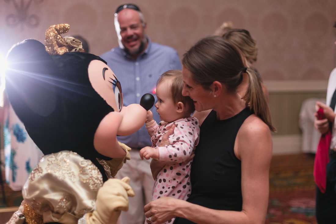 Top Orlando wedding photographer and videographer capture fun themed wedding at Disney's wedding pavilion at the grand floridan in Orlando