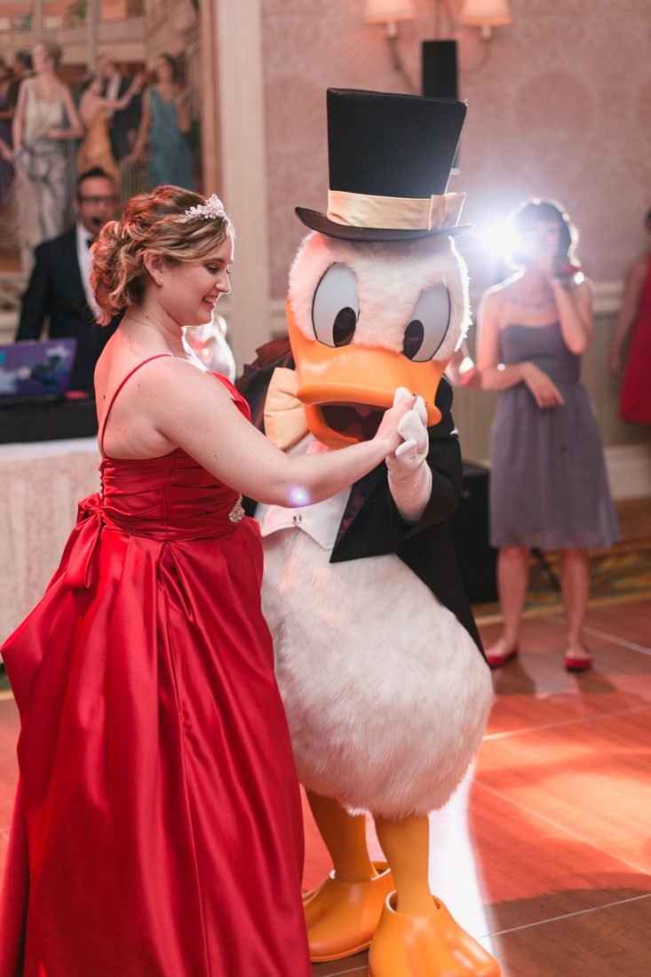 Top Orlando wedding photographer and videographer capture fun themed wedding at Disney's wedding pavilion at the grand floridan in Orlando