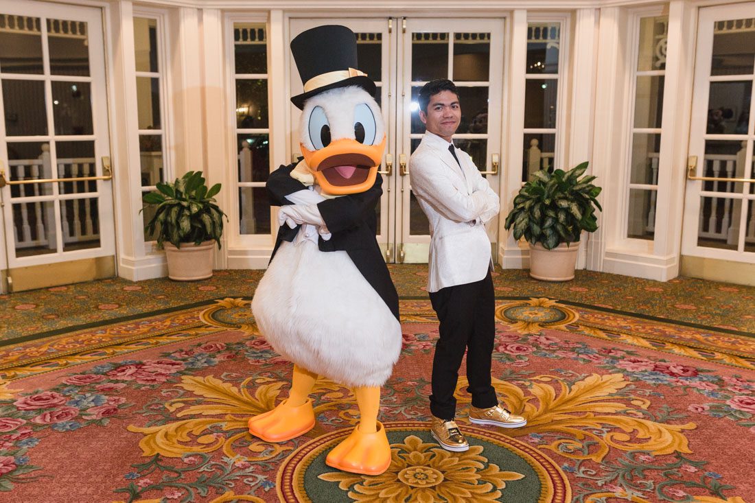 Top Orlando wedding photographer and videographer capture fun themed wedding at Disney's wedding pavilion at the grand floridan in Orlando
