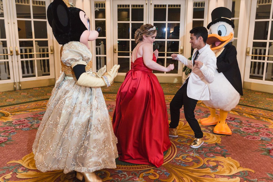 Top Orlando wedding photographer and videographer capture fun themed wedding at Disney's wedding pavilion at the grand floridan in Orlando