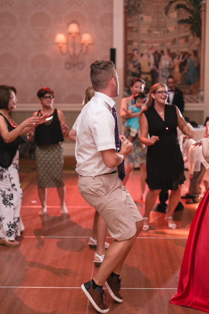 Top Orlando wedding photographer and videographer capture fun themed wedding at Disney's wedding pavilion at the grand floridan in Orlando