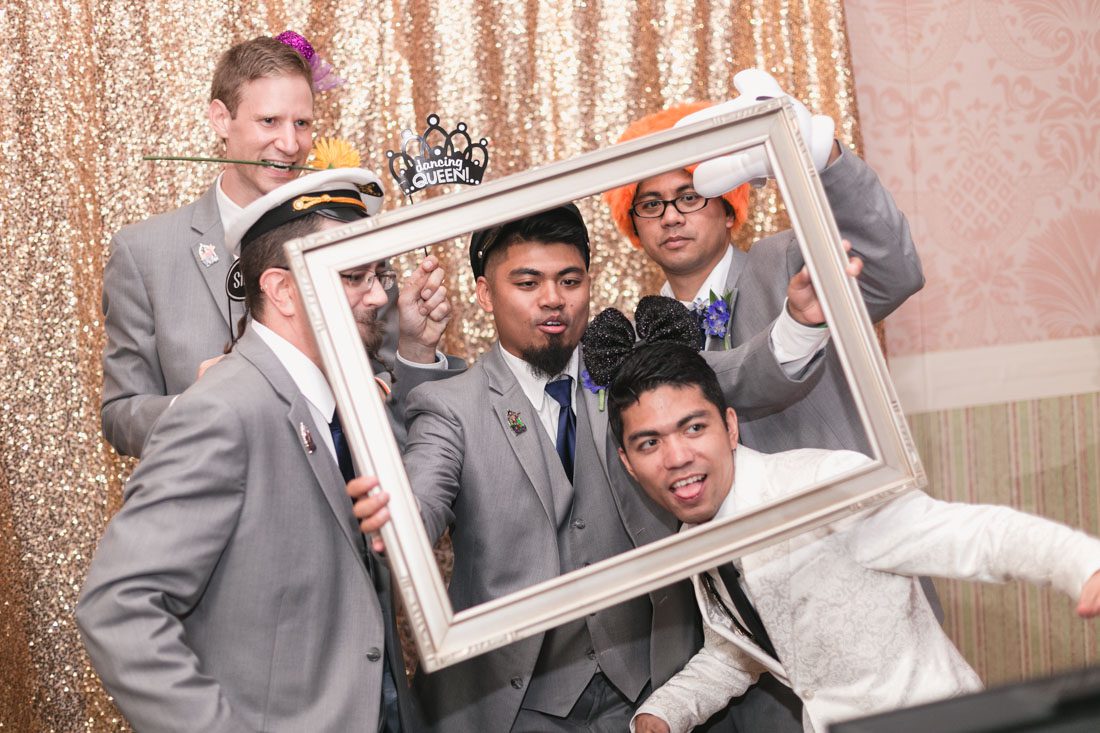 Top Orlando wedding photographer and videographer capture fun themed wedding at Disney's wedding pavilion at the grand floridan in Orlando