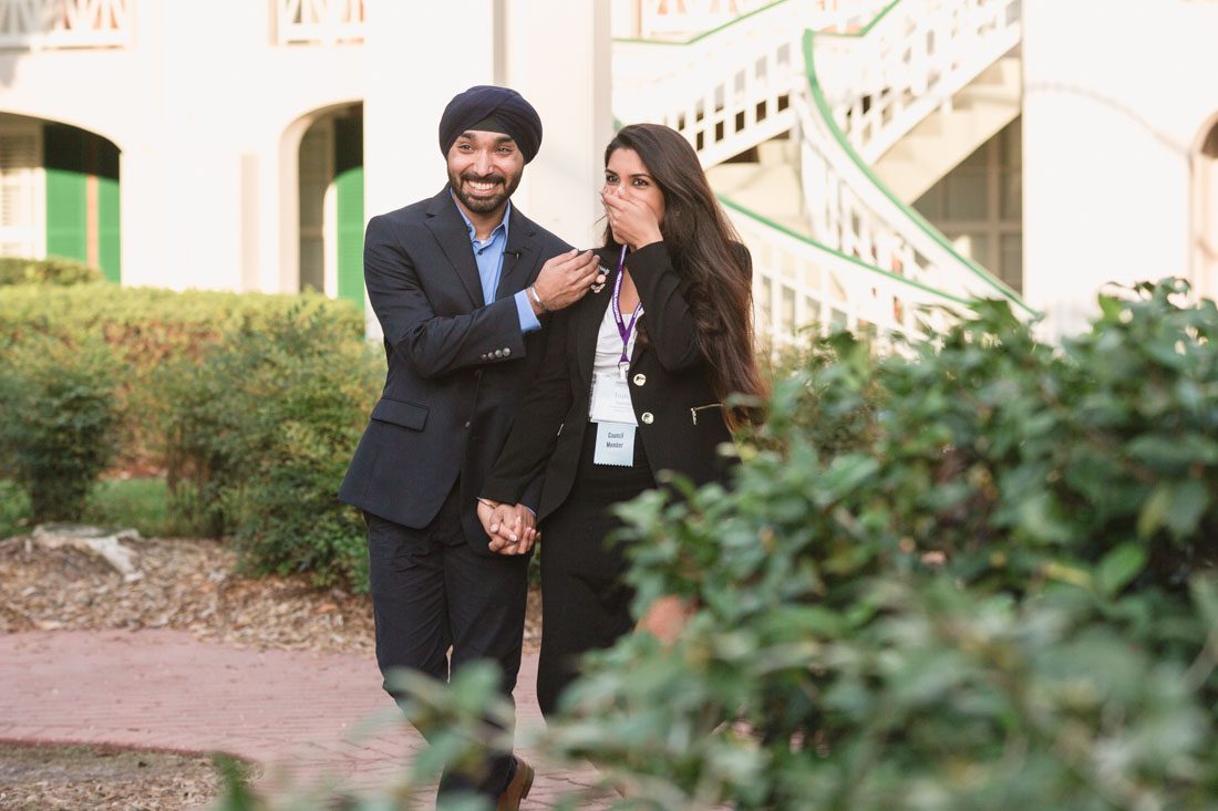 Orlando engagement and proposal photographer captures surprise proposal at Disney resort featuring a gazebo and horse carriage