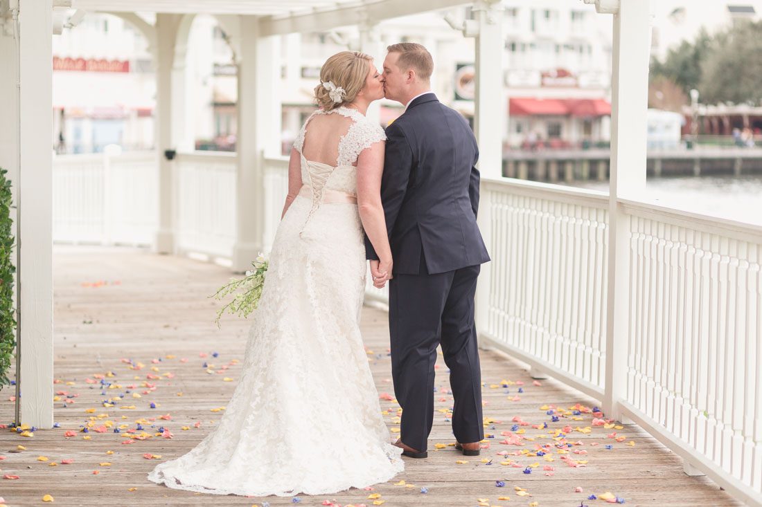 Orlando wedding photographer captures winter Christmas nuptials at Sea Breeze Point at the Boardwalk Inn with reception at Epcot in Disney
