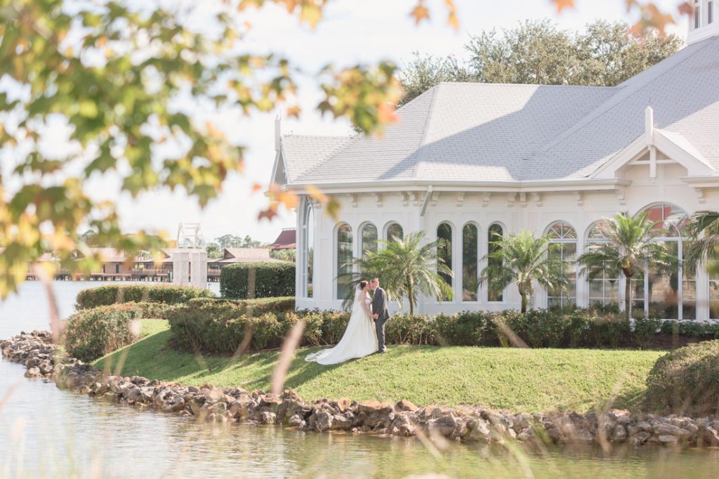 Orlando wedding photographer captures couple in front of the Disney wedding pavilion for portraits