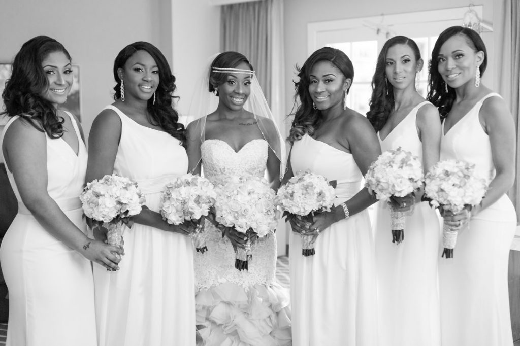 Bride with her bridesmaids by top Orlando wedding photographer