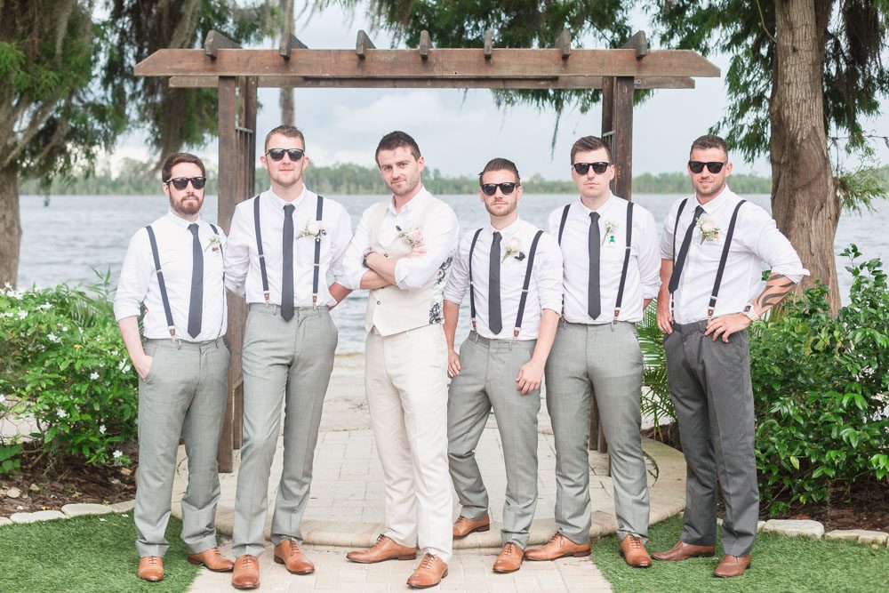 Bridal party posing with the groom at Paradise Cove at top wedding venue in Orlando, Florida