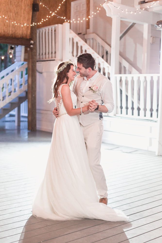 Orlando wedding photographer captures a romantic first dance under the twinkle lights at paradise cove