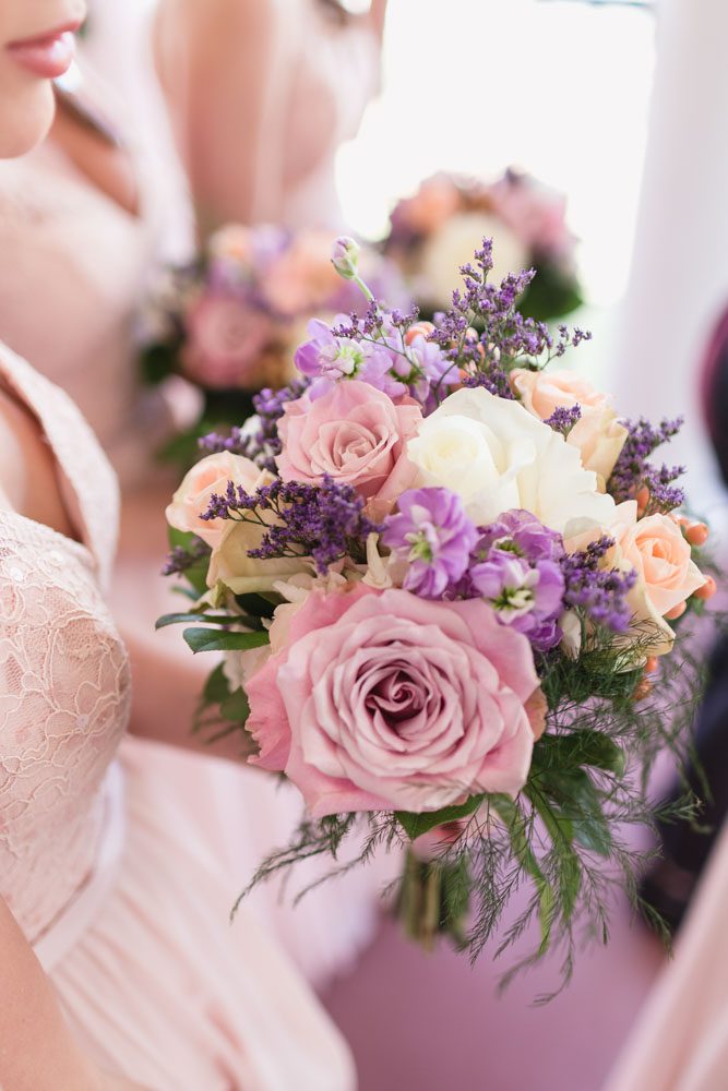 Orlando wedding photographer captures beautiful Blush pink and purple bouquets for a rustic country wedding 
