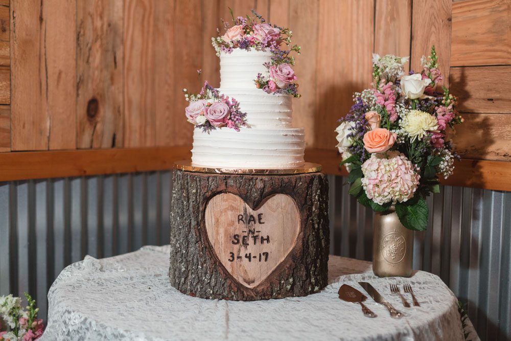 Rustic Country Wedding Cake With Buttercream On A Tree Trunk Wooden Stand Rustic Country Wedding Cake With Buttercream On A Tree Trunk Wooden Stand