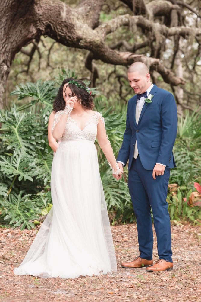 Bride has an emotional reaction during a beautiful outdoor wedding ceremony captured by top Orlando wedding photographer