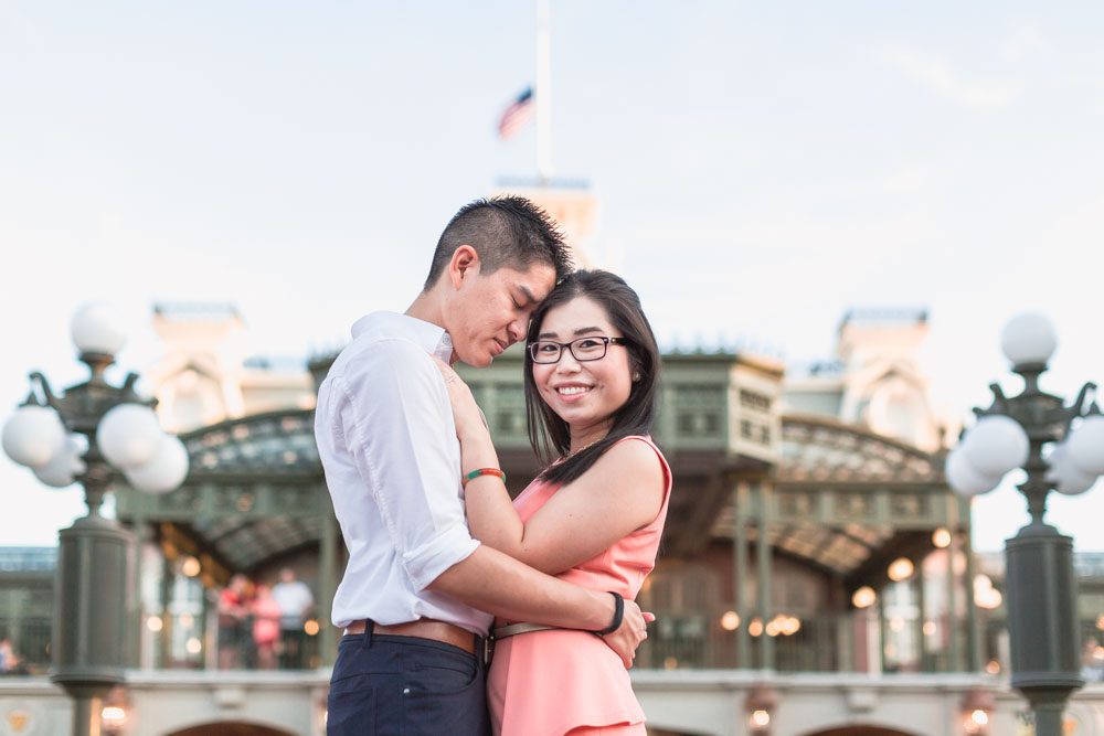 Disney engagement photography session at the entrance to Magic Kingdom Park in Orlando captured by top photographer