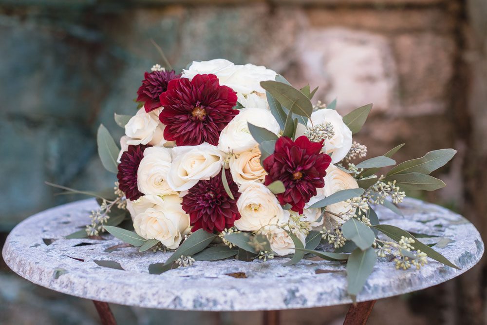 Bridal floral bouquet featuring burgundy red and white blooms during this Port Orange Estate wedding