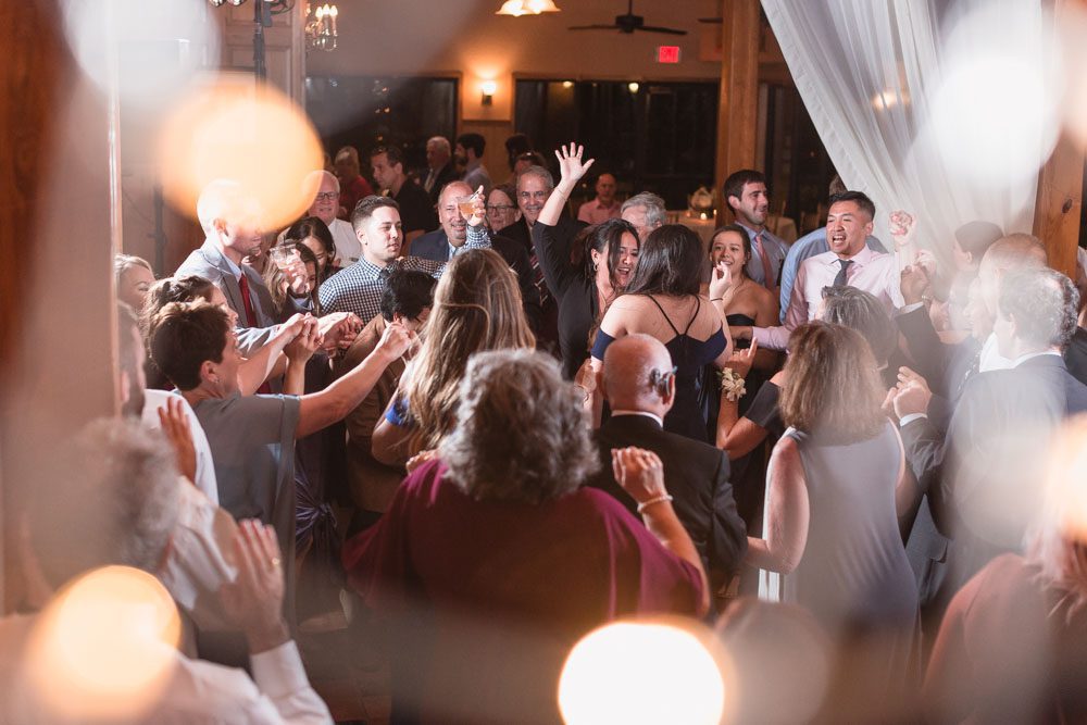 Creative photo of the guests dancing during an Estate on the Halifax wedding reception captured by Orlando photographer