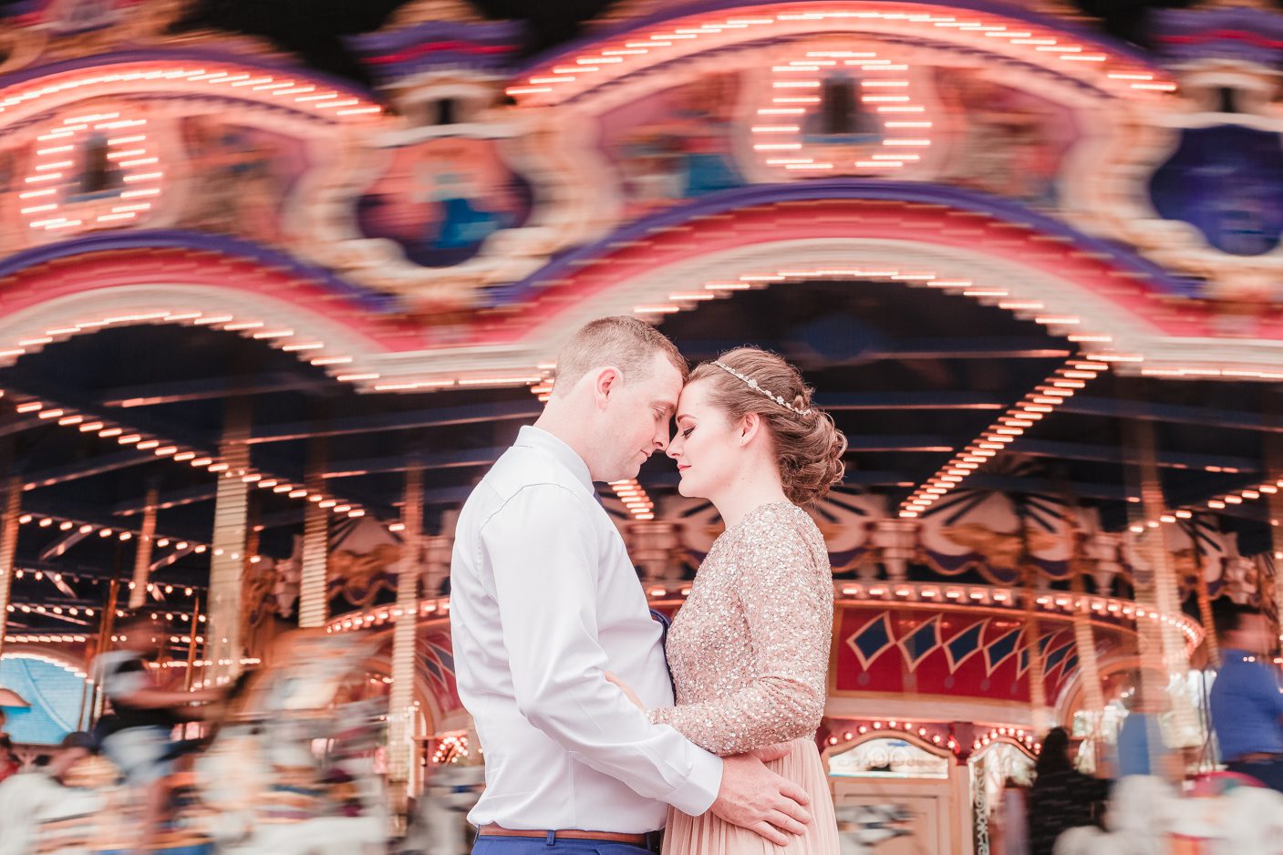 Disney wedding at Orlando Magic Kingdom in front of the carousel by top photographer