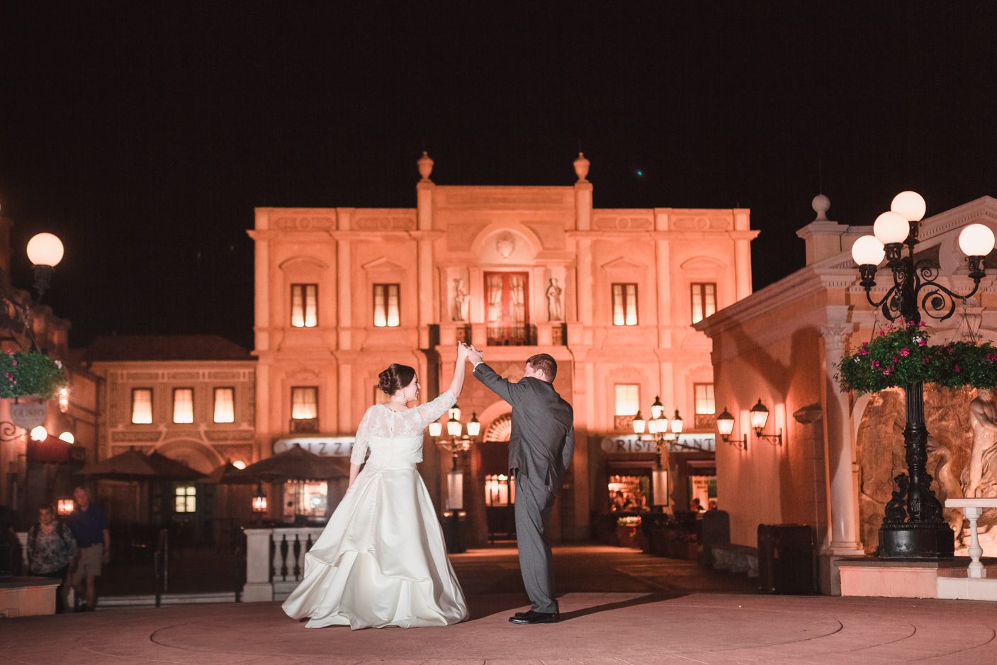 Bride and groom dance at the Italy pavilion in Epcot during their Disney Orlando wedding