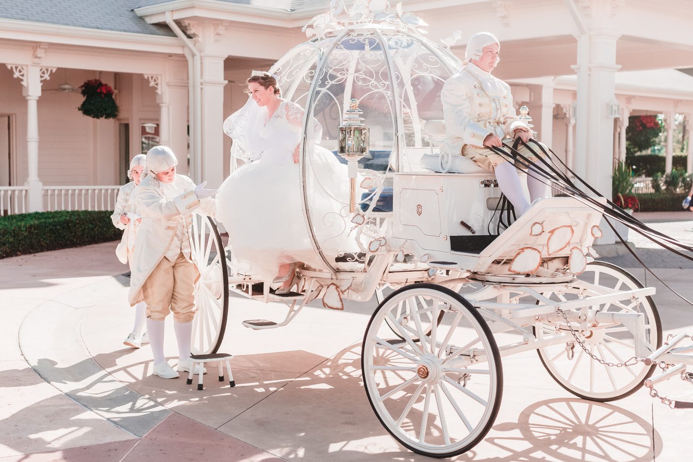Bride exits Cinderella carriage with horses for Disney wedding in Orlando