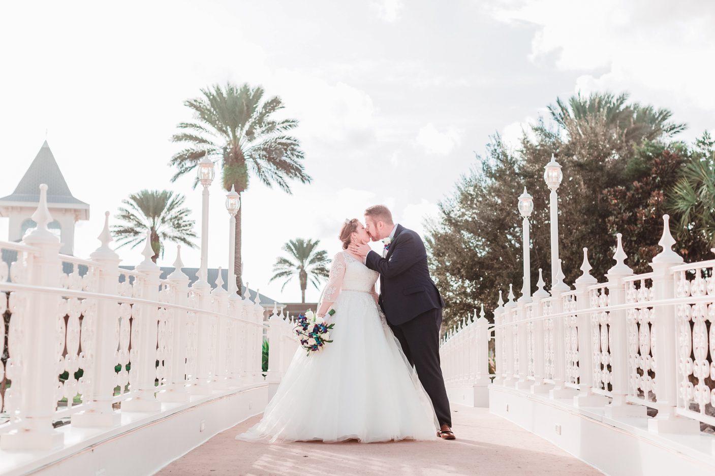 Disney bride and groom in front of the wedding pavilion in Orlando 