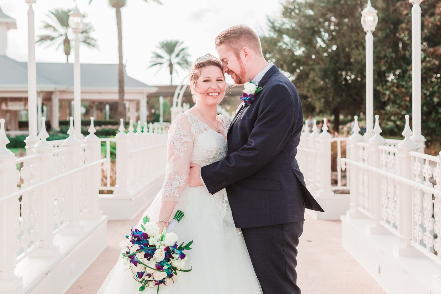 Disney bride and groom in front of the wedding pavilion in Orlando 