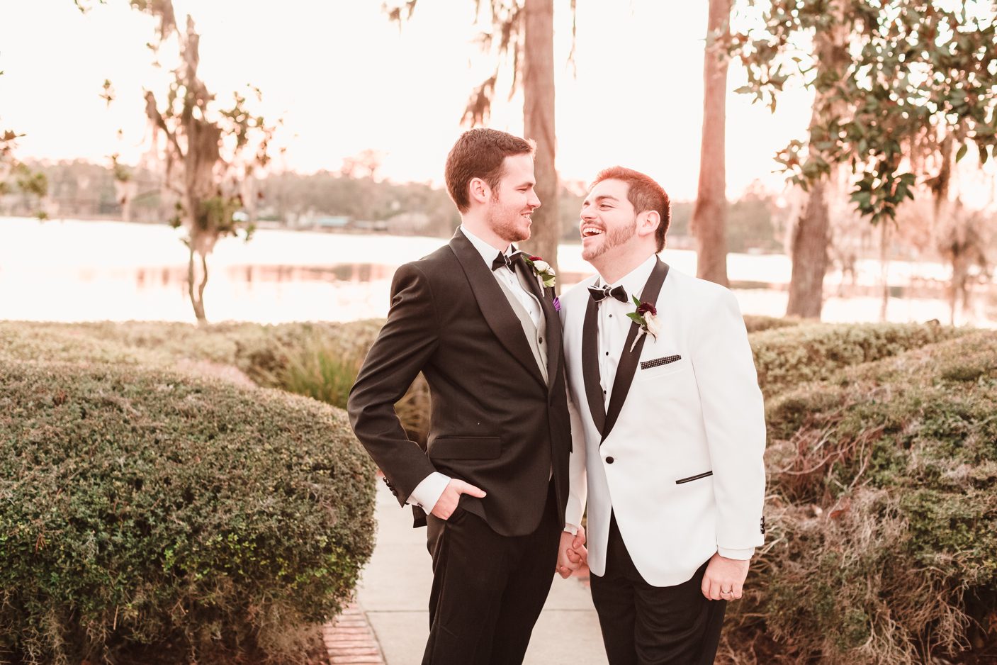 Two grooms celebrate after getting married at their gay wedding at Cypress Grove Estate House in Orlando