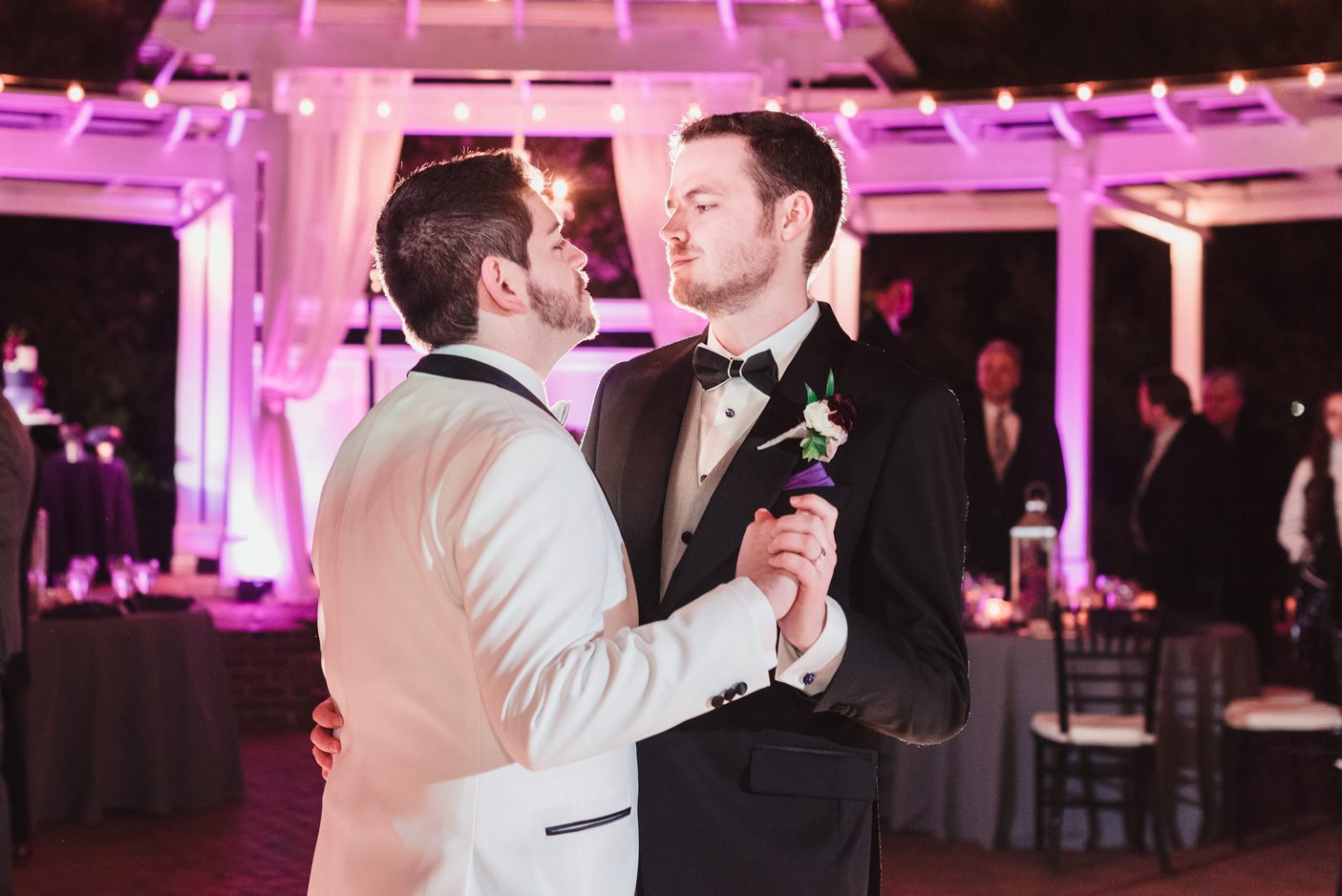 Two grooms dancing at Cypress Grove Estate house captured by top Orlando LGBT wedding photographer