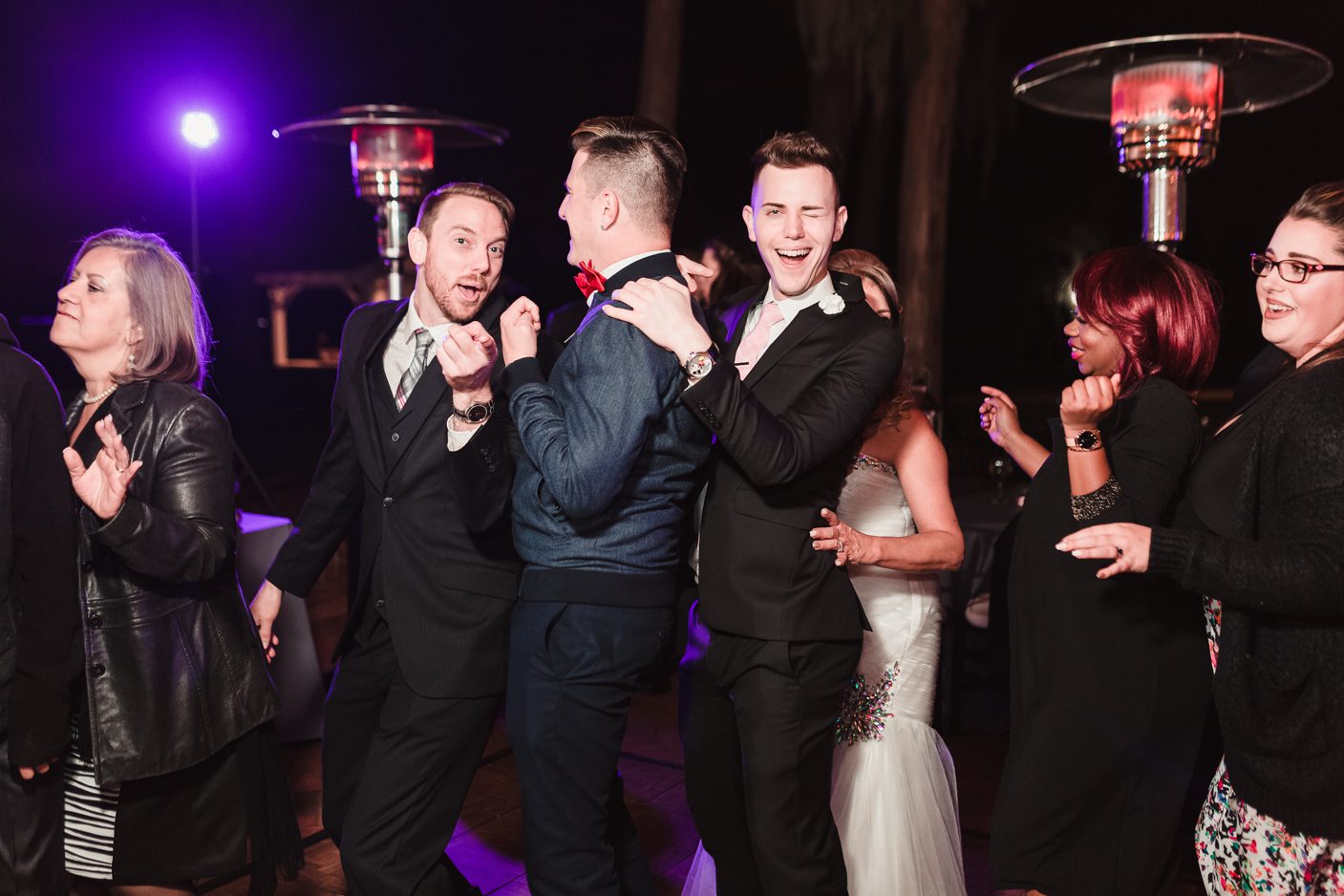 Guests dancing at Cypress Grove Estate house captured by top Orlando LGBT wedding photographer
