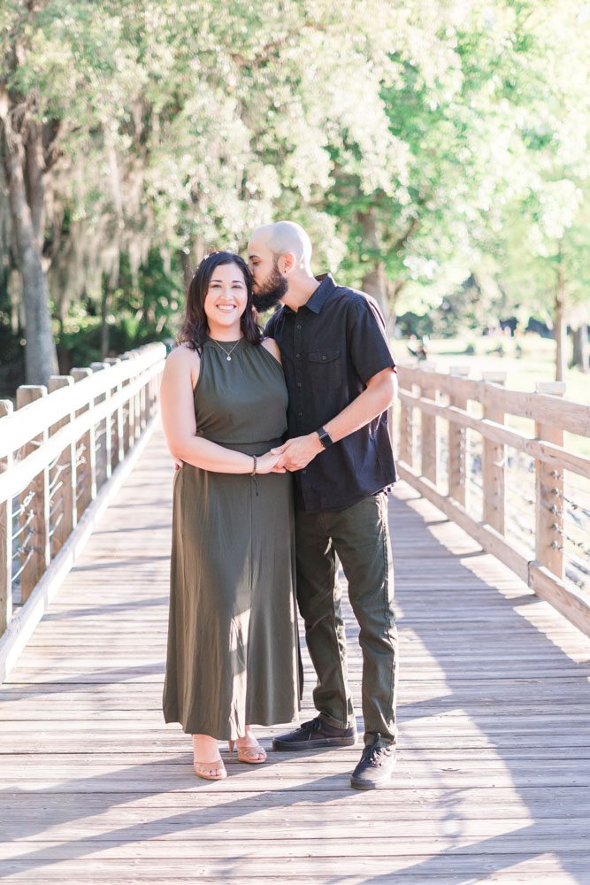 Candid and romantic engagement session at sunset in Celebration captured by top Orlando photographers