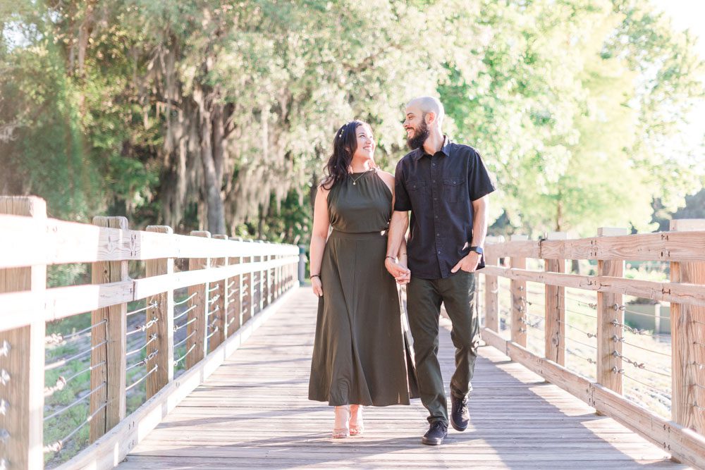 Candid and romantic engagement session at sunset in Celebration captured by top Orlando photographers
