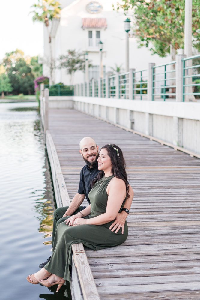 Fun engagement session on the lakefront pier in Celebration dock captured by top Orlando engagement photography team