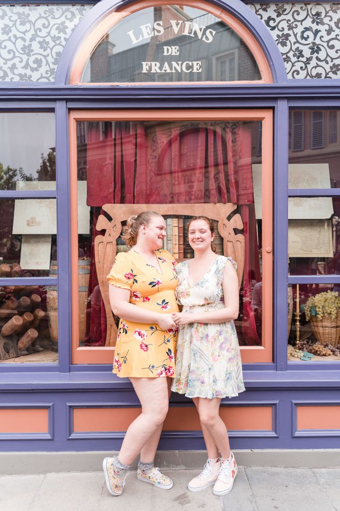 Same-sex engagement photography at world showcase in Epcot captured by top Orlando LGBT photographer