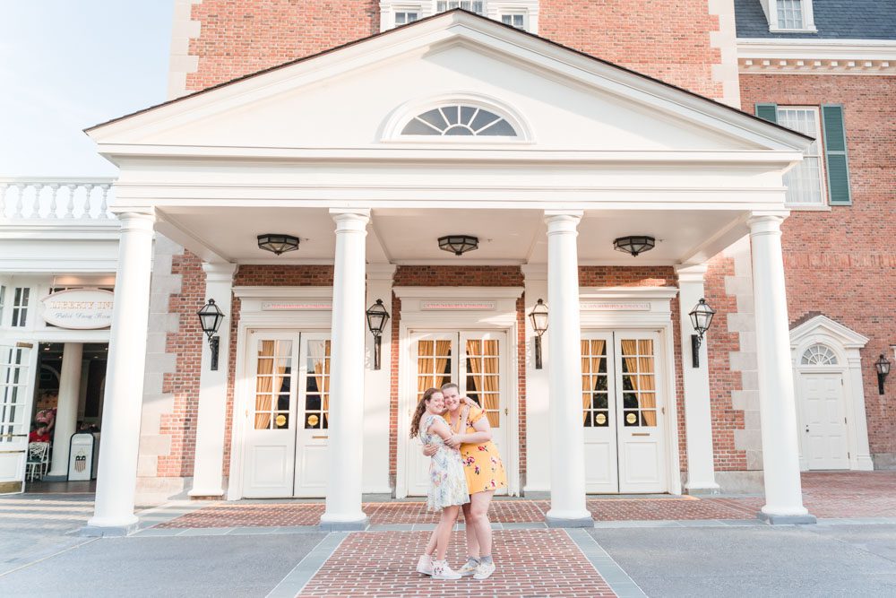 Romantic lesbian engagement session at Disney in Epcot during Flower and Garden Festival captured by top Orlando gay wedding photographer