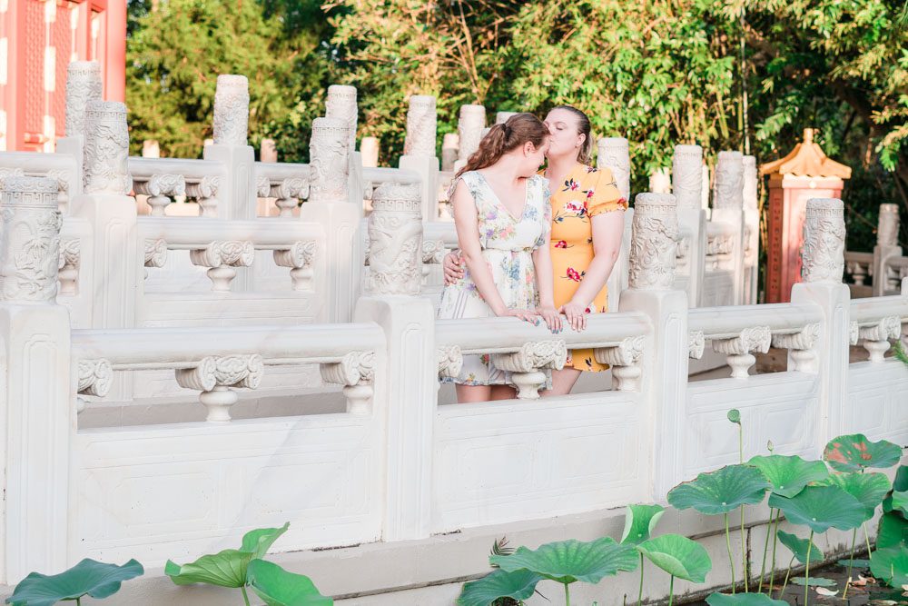 Romantic lesbian engagement photo in China at Epcot captured by top Orlando photographer for gay weddings
