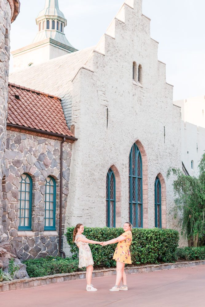 Romantic and fun same-sex engagement session at Disney's Epcot Park captured by top Orlando proposal and engagement photographer