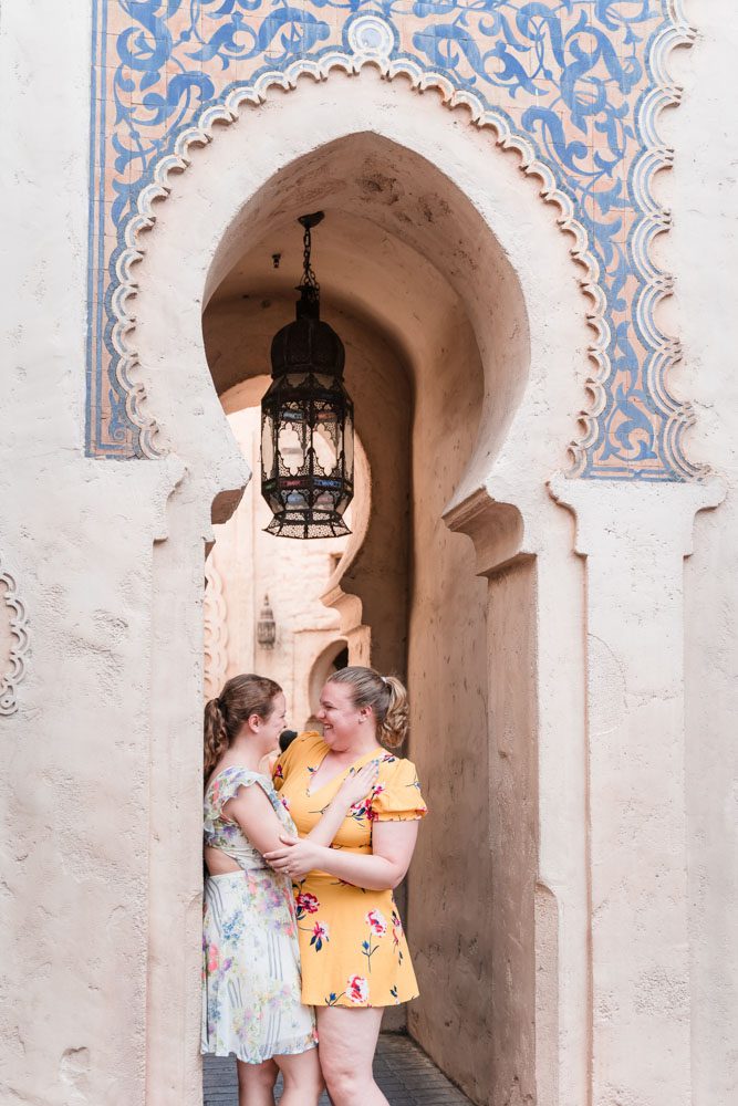 Romantic same-sex engagement session at Morocco in Epcot at Disney World captured by top Orlando gay wedding photographer