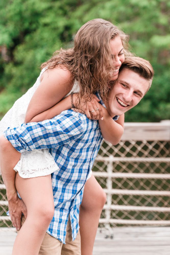 Playfun and fun engagement photo at Disney resort captured by top Orlando wedding photographer
