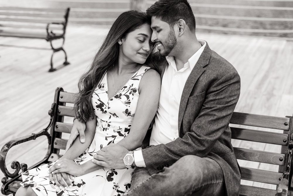 Intimate black and white engagement photo on the dock at the Grand Floridian captured by top Orlando engagement photographer