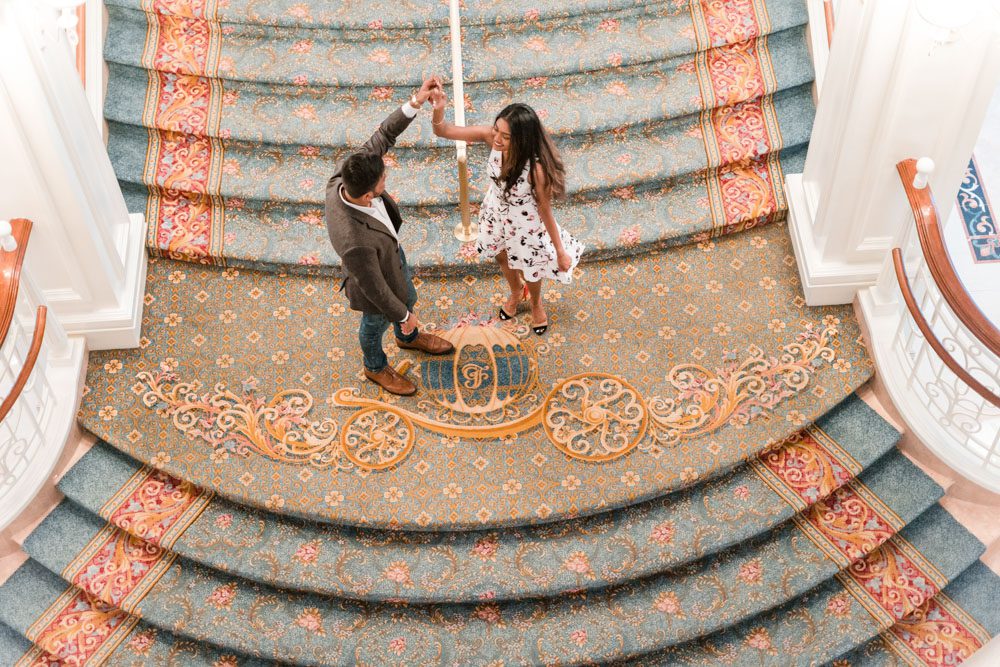 Engagement photography inside the Grand Floridian staircase captured by top Orlando photographers