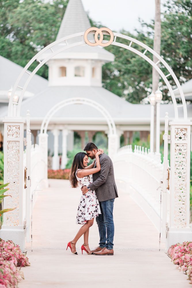 Romantic and fun engagement session photography at picture point at the wedding pavilion at the Grand Floridian Resort in Walt Disney World Orlando