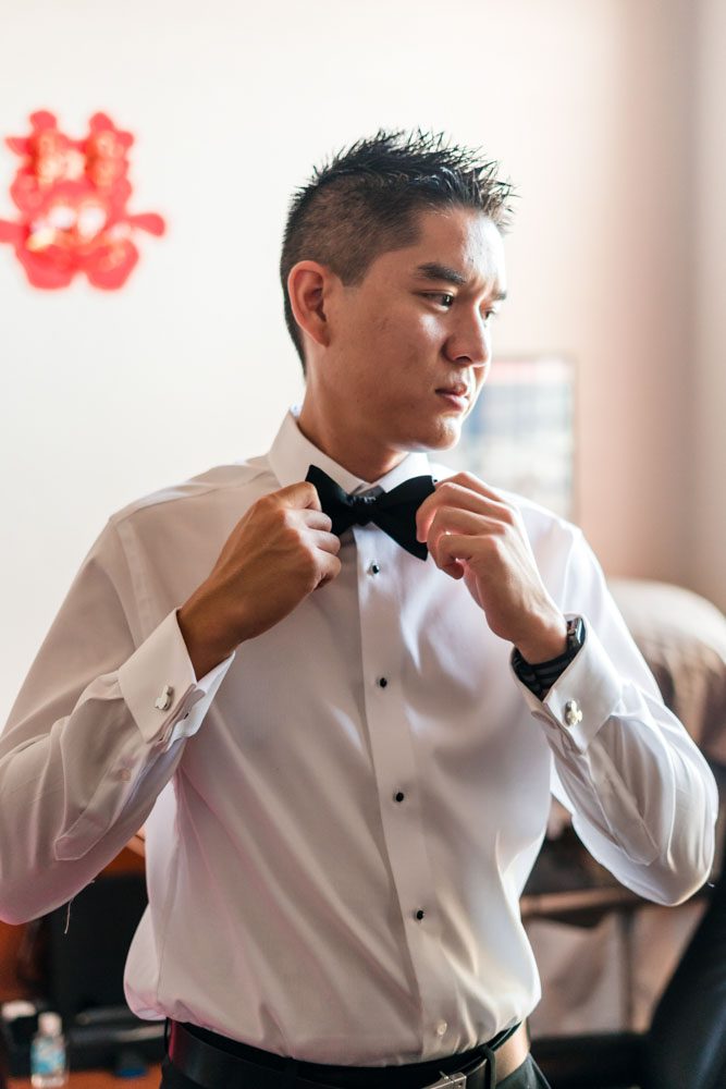 Groom getting ready for his wedding day in Oklahoma captured by photographers from Orlando