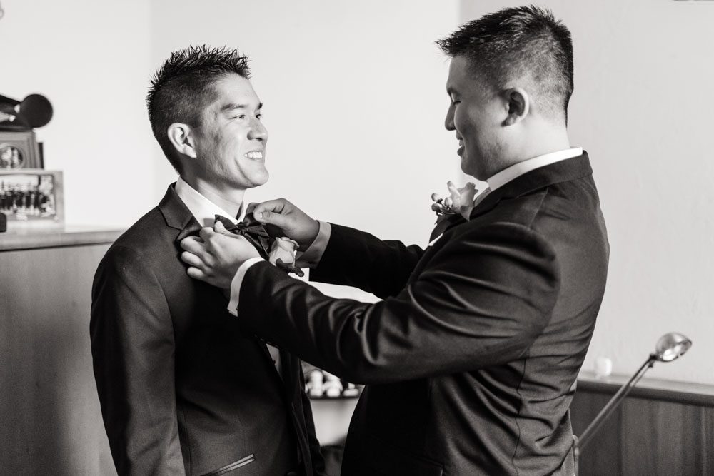 Groom getting ready for his wedding day in Oklahoma captured by photographers from Orlando
