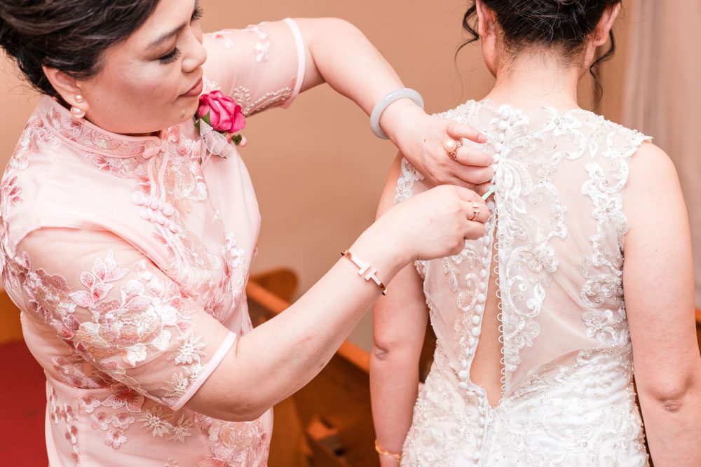Bride getting ready for her wedding day in Oklahoma captured by photographers from Orlando