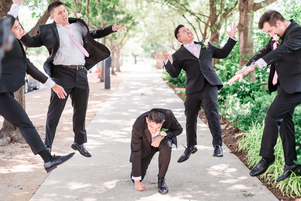 Fun portrait of the groom and his groomsman taken by top Orlando photography team in Oklahoma City