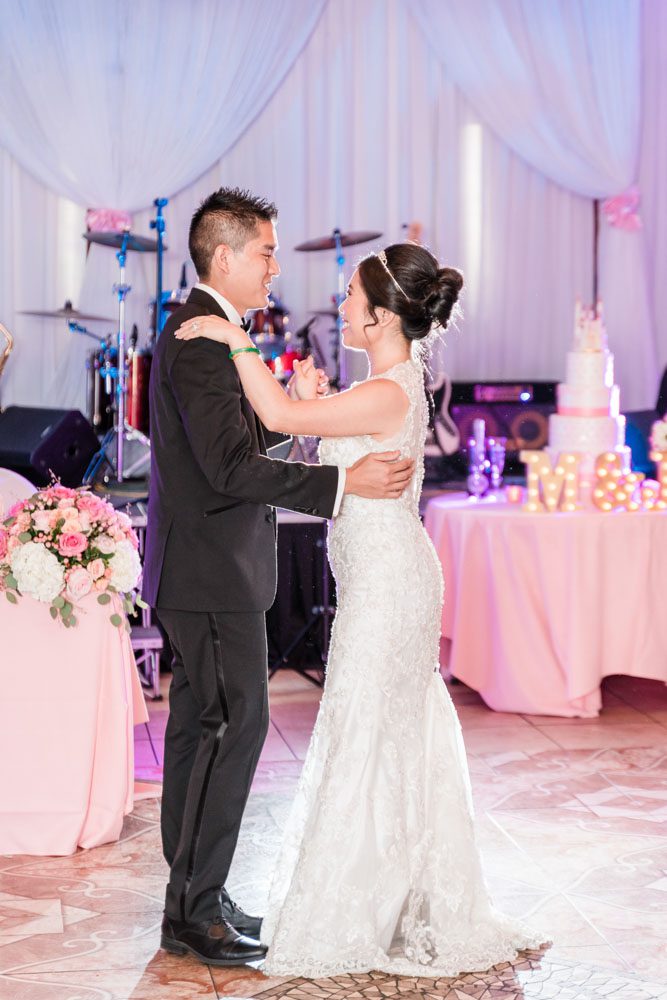 Bride and groom share their first dance at the Hy Palace in Oklahoma captured by traveling wedding photographers from Orlando