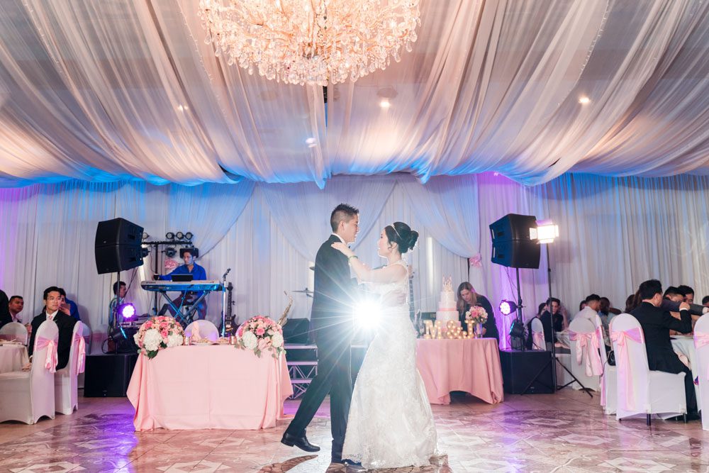 Bride and groom share their first dance at the Hy Palace in Oklahoma captured by traveling wedding photographers from Orlando