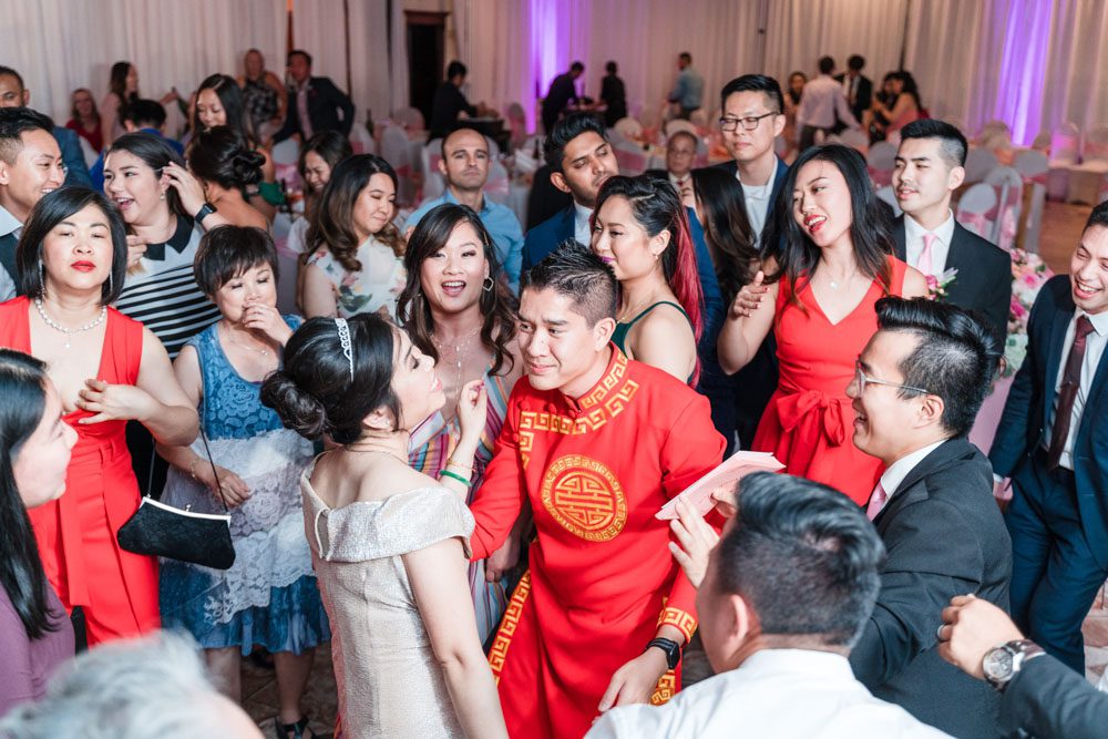 Fun and candid photography of bride and groom on the dance floor at their Hy Palace wedding reception in Oklahoma City